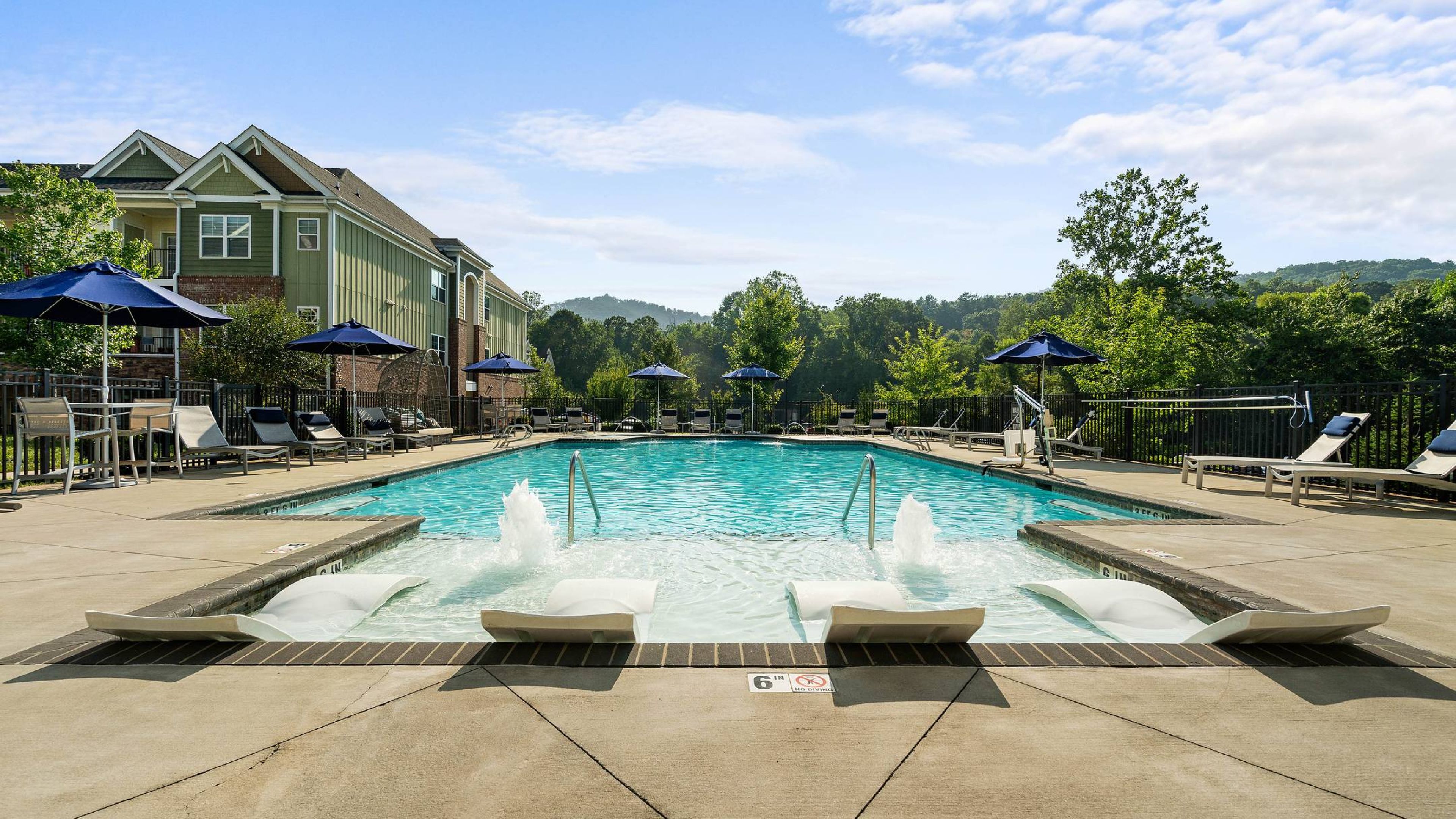 Hawthorne at Southside apartments pool with lounge chairs